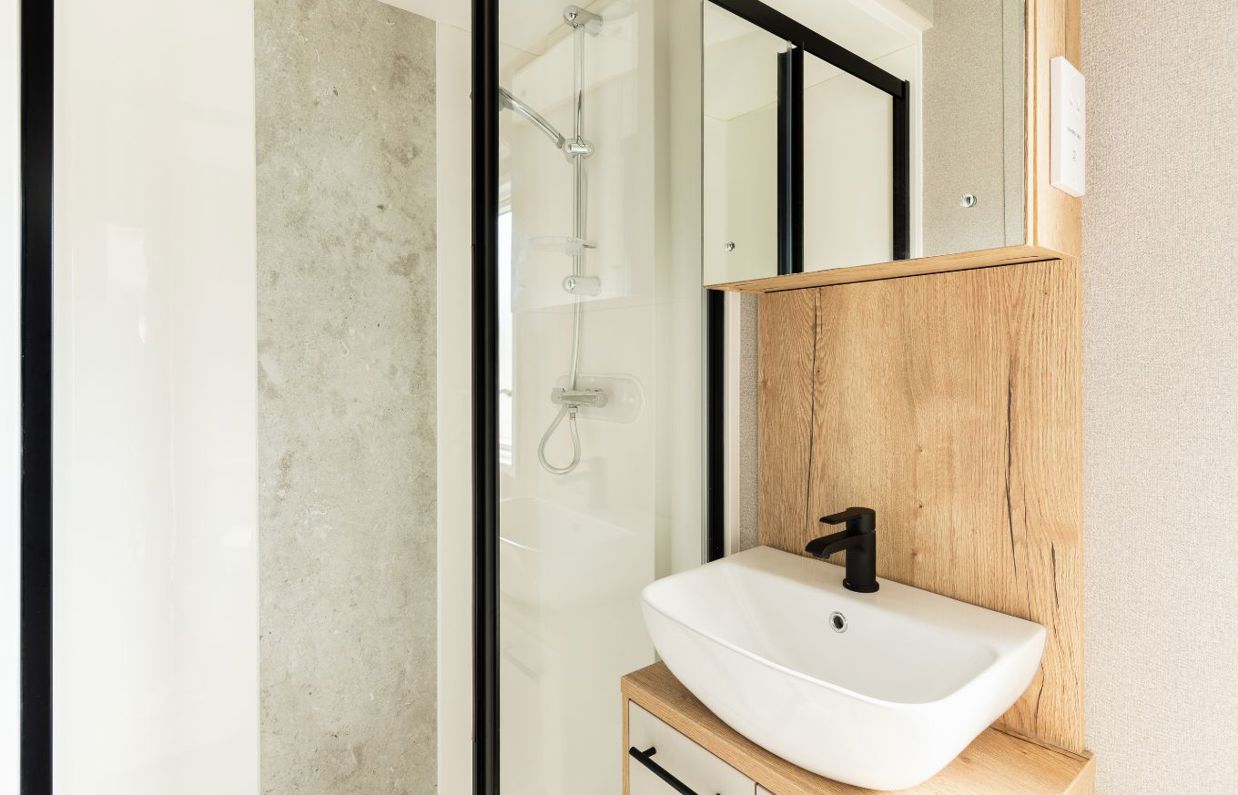 Internal of a caravan bathroom with shower and sink