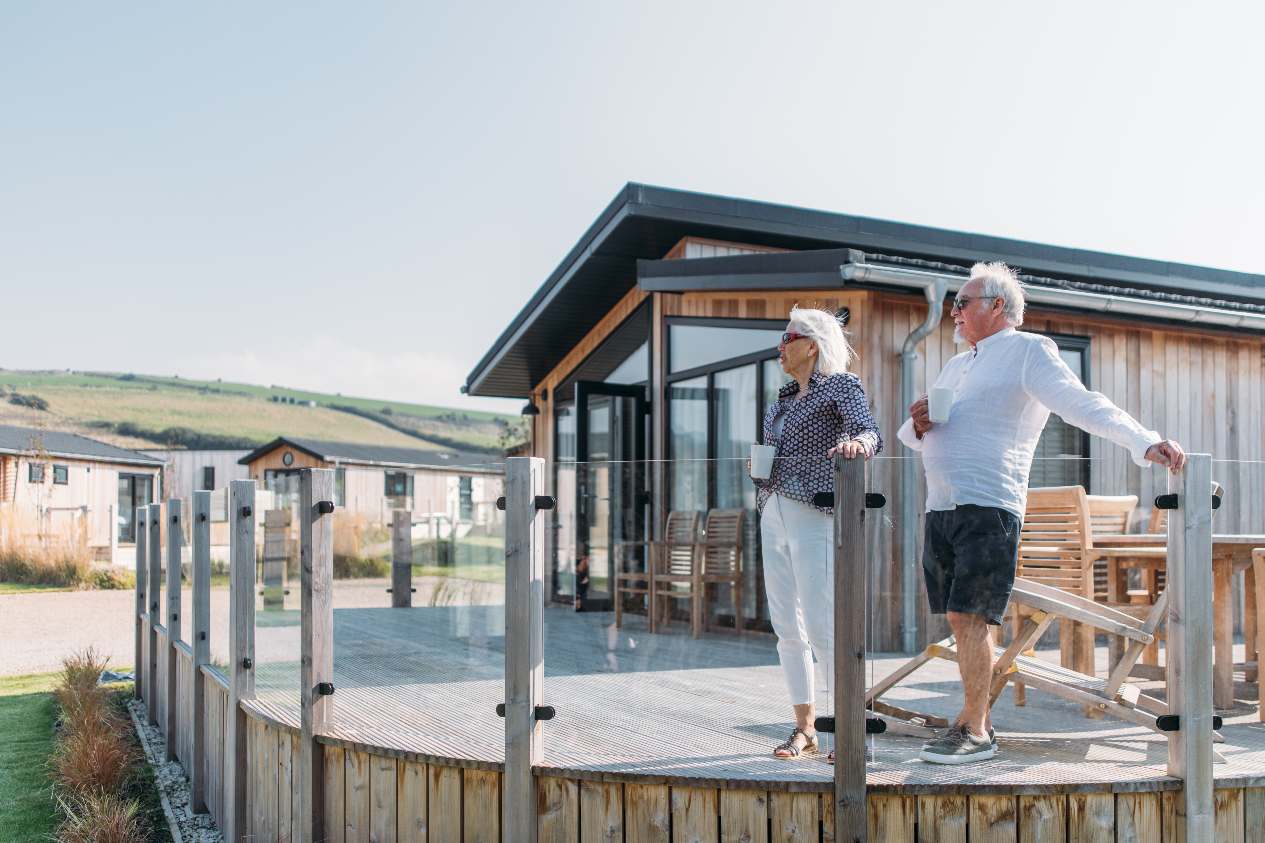 Older couple on lodge decking at The Stables