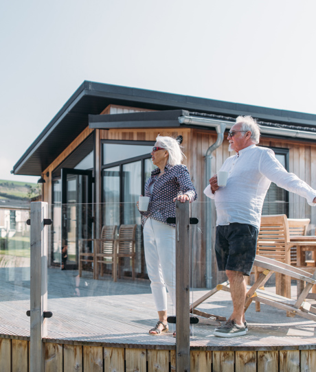 Older couple on lodge decking at The Stables
