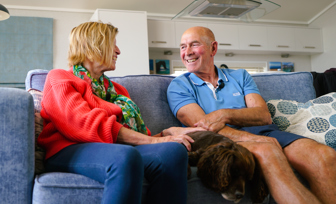 Osmington Owners on sofa looking at each other