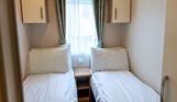 Internal of a caravan twin bedroom