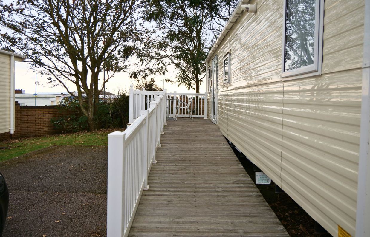External of an accessible caravan ramp to entrance with decking