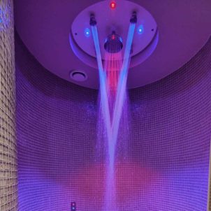 A rainfall shower with mood lighting