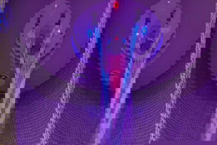 A rainfall shower with mood lighting