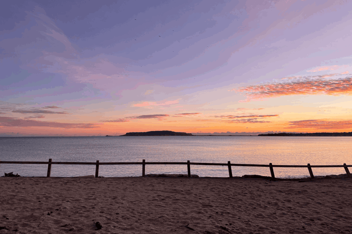 View across to Portland from Bowleaze Cove Holiday Park and Spa at Sunset