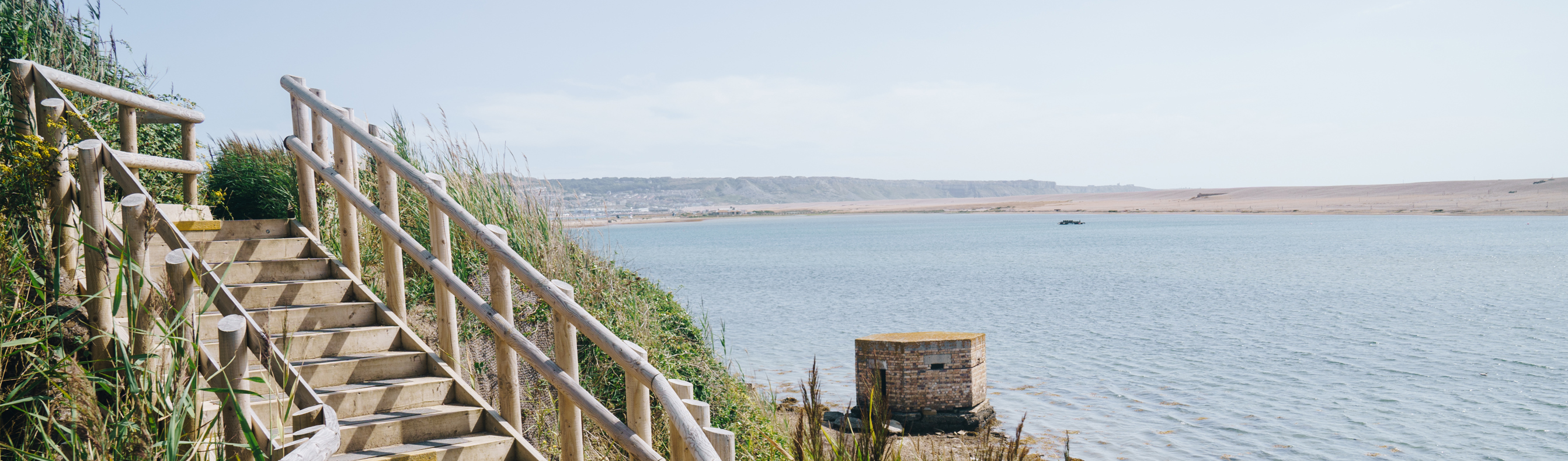 View of the Jurassic Coast, Chesil Beach and sea from the coast path