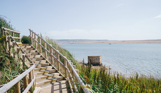 View of the Jurassic Coast, Chesil Beach and sea from the coast path