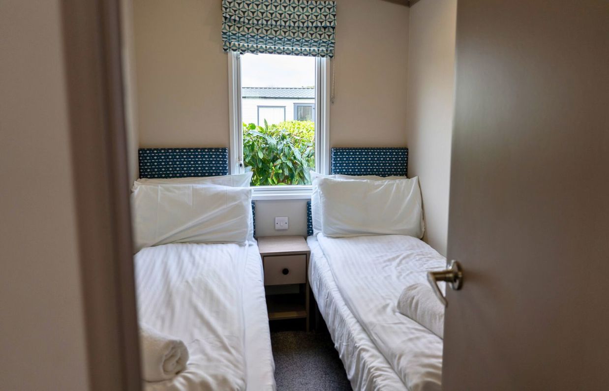 Internal of a caravan twin bedroom