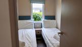 Internal of a caravan twin bedroom