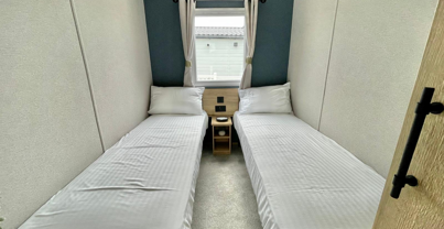 Internal of a caravan twin bedroom