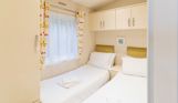 Internal of a caravan twin bedroom