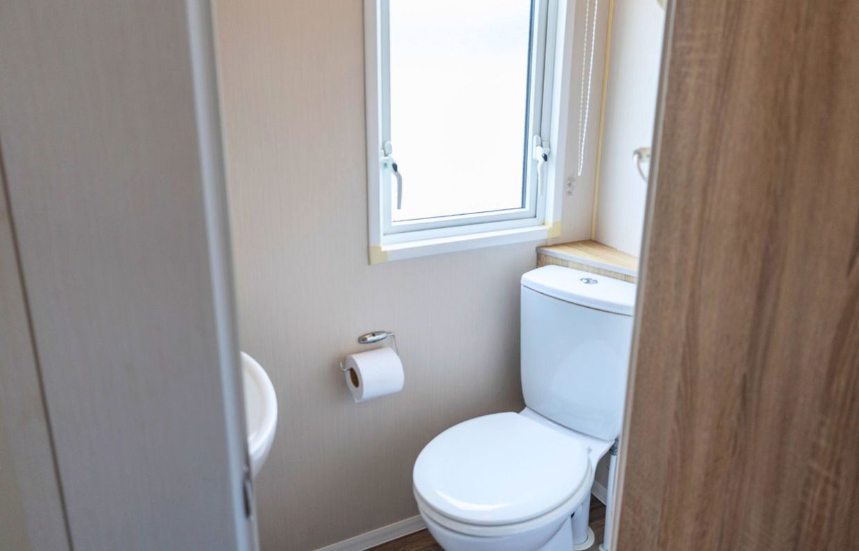 Internal of a caravan bathroom with toilet and sink