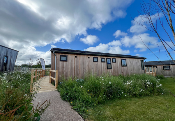External of a luxury lodge on pitch