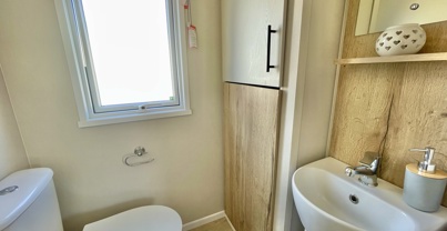 Internal of a caravan bathroom with toilet and sink