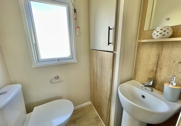 Internal of a caravan bathroom with toilet and sink