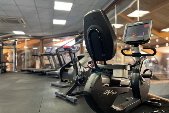 Inside of a modern gym facility with various equipment