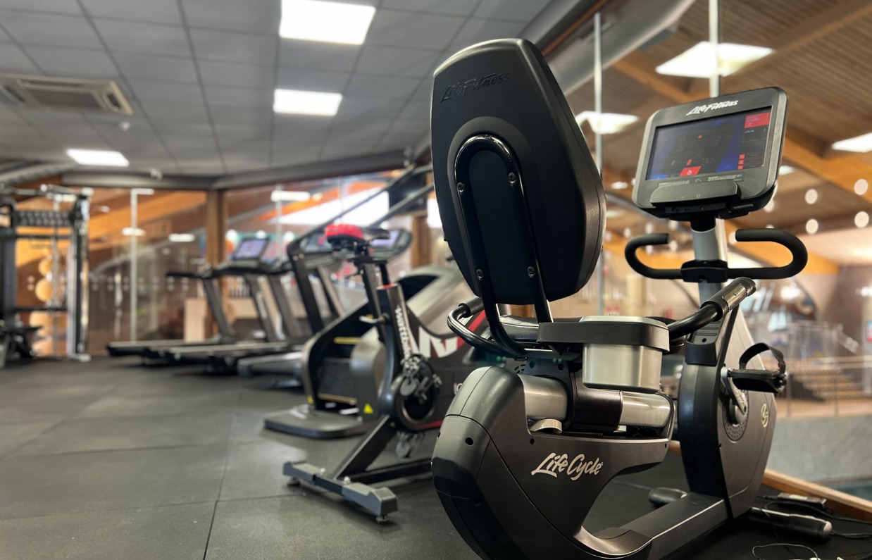Inside of a modern gym facility with various equipment