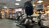 Inside of a modern gym facility with various equipment