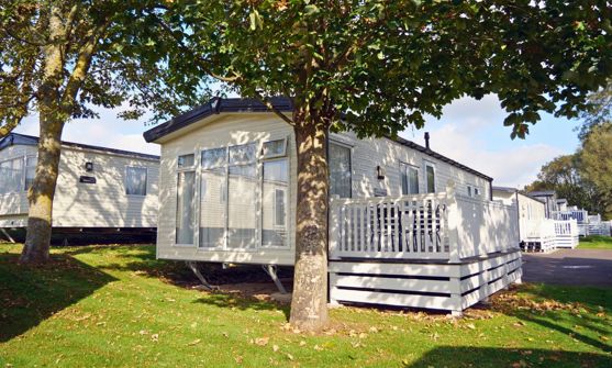 External of a caravan on pitch with decking