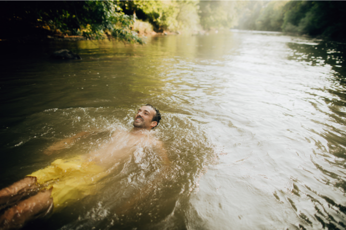 A man wild swimming