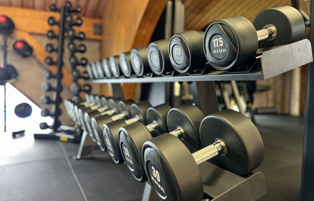 Inside of a modern gym facility with various equipment