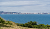 The view of the sea and Weymouth through countryside from Osmington Mills Lodge Park