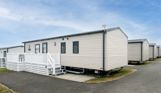 External of a caravan on pitch with decking