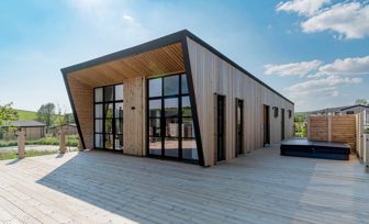 Exterior of a Super Lodge and Large Decking with Hot Tub