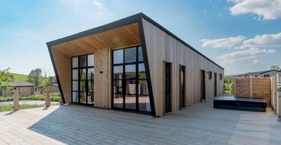 Exterior of a Super Lodge and Large Decking with Hot Tub