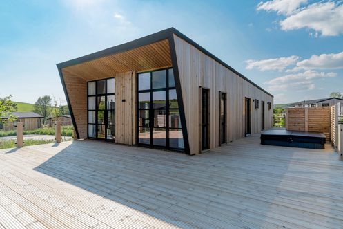 Exterior of a Super Lodge and Large Decking with Hot Tub