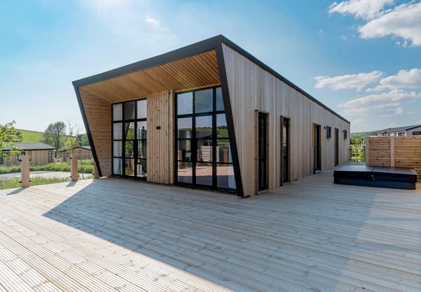 Exterior of a Super Lodge and Large Decking with Hot Tub