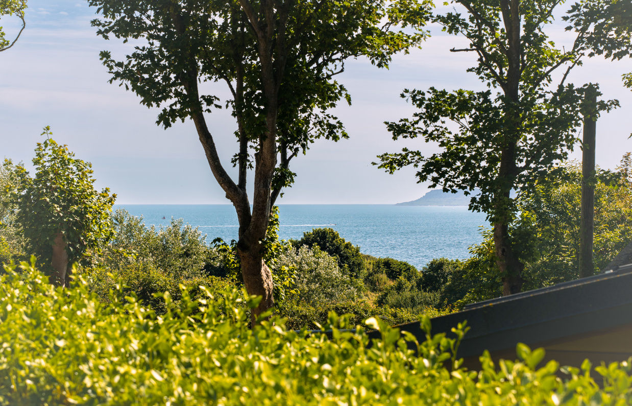 The view of the sea and Portland through countryside from Osmington Mills Lodge Park
