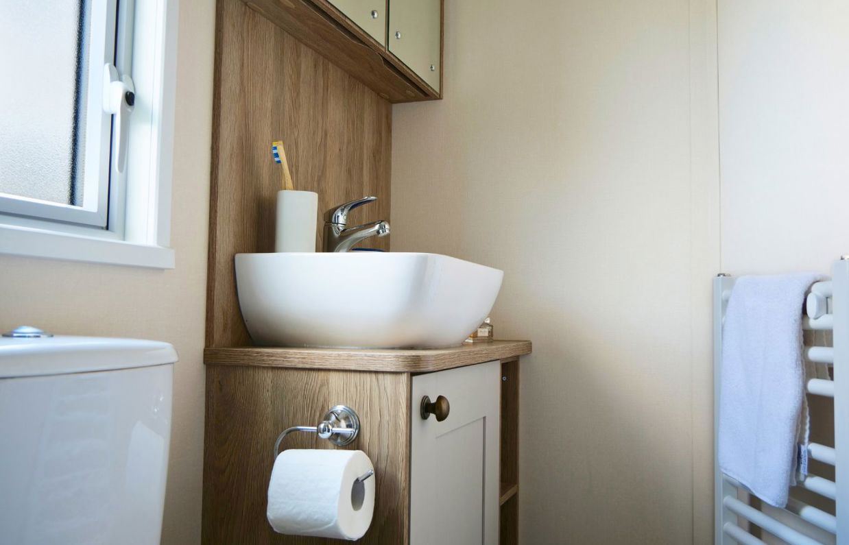 Internal of a caravan bathroom with toilet and sink