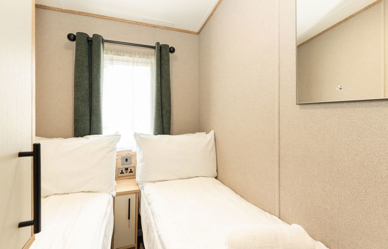 Internal of a caravan twin bedroom