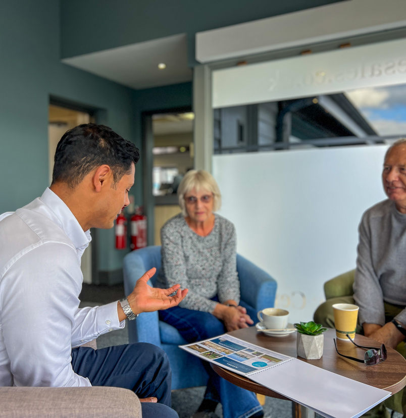 Couple talking with Sales Team Member on an Experience Day