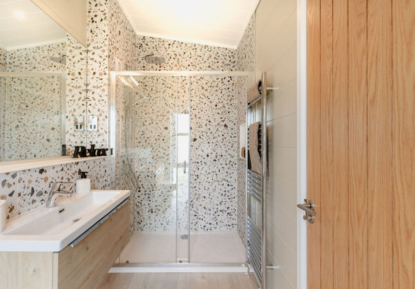 Internal of a luxury lodge ensuite bathroom with walk-in shower and sink