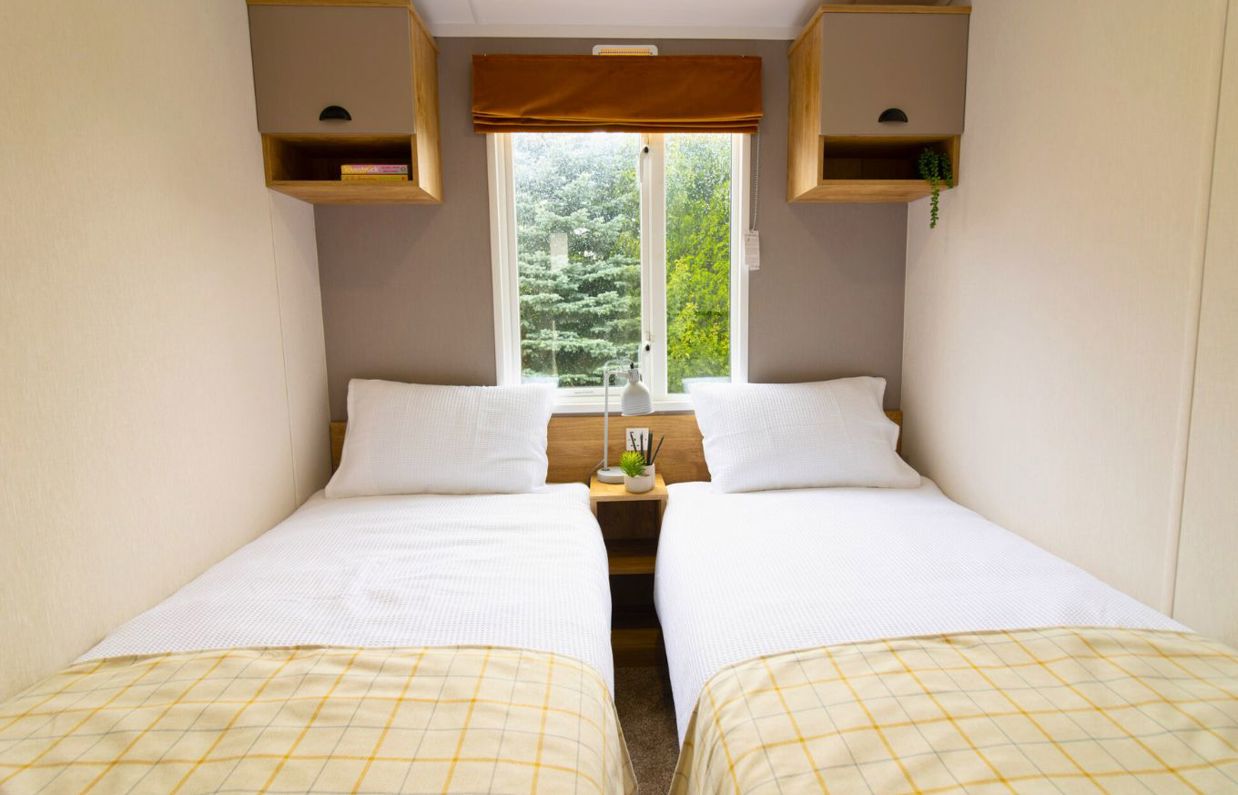 Internal of a caravan twin bedroom