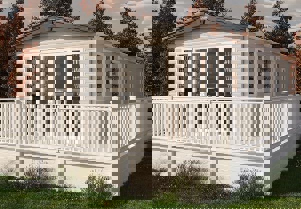 Cladded exterior of holiday home with wrap-around decking