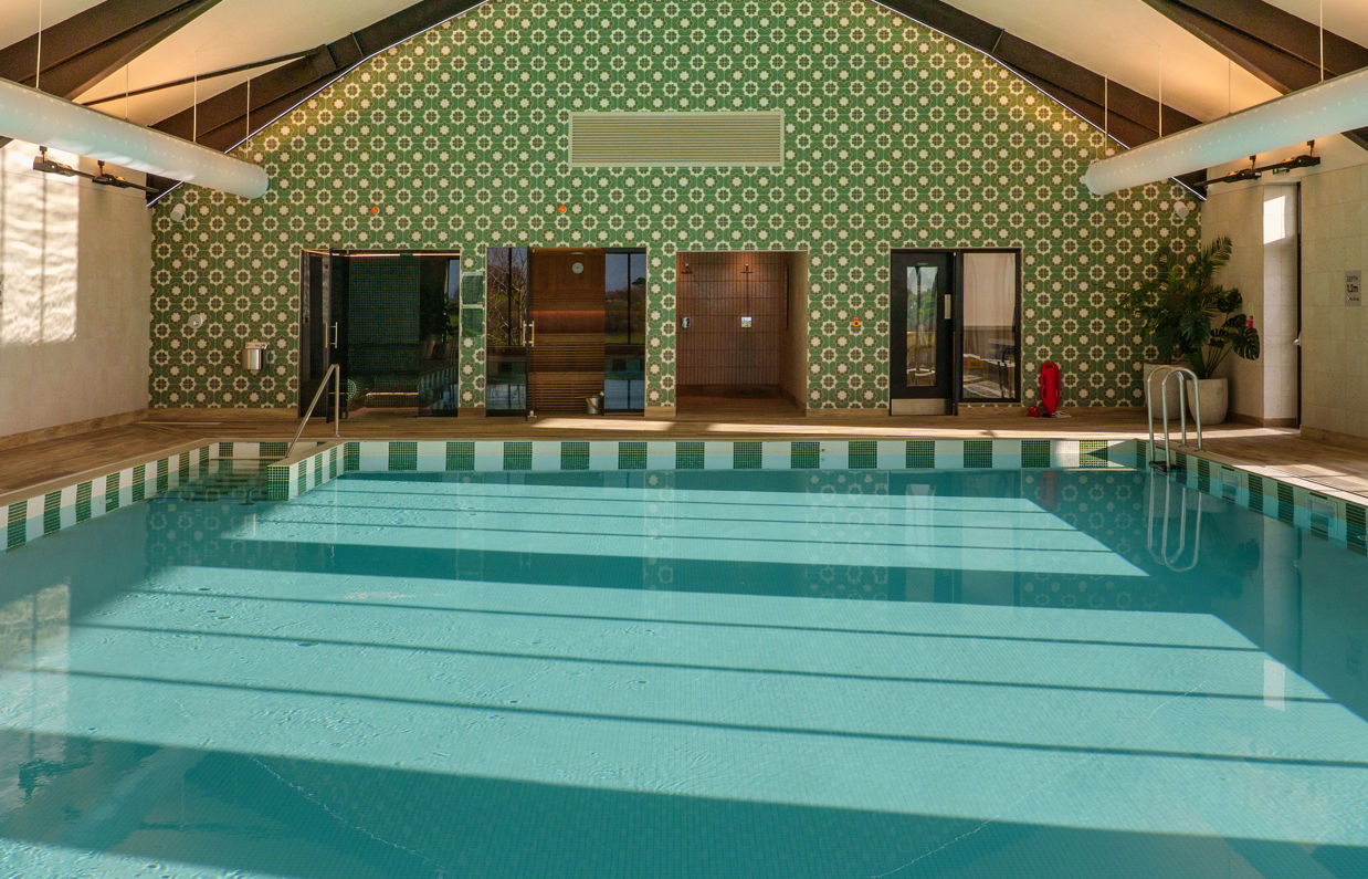 The Barn Swimming Pool from far end with sunlight on water