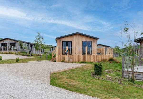 External of a luxury lodge on pitch with decking