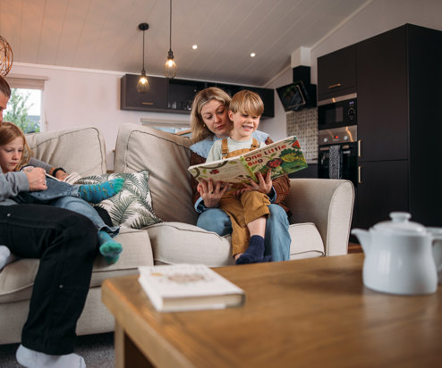 Family enjoying quiet time at holiday home in Tregoad