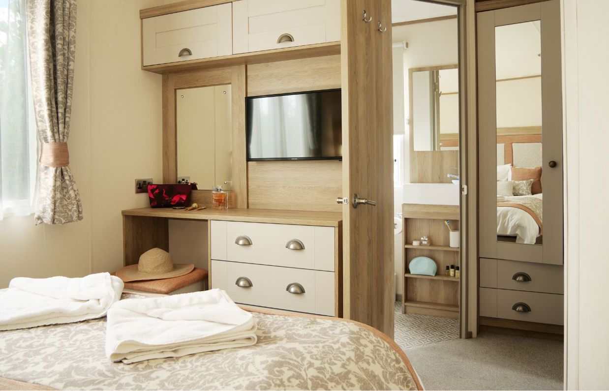 Internal of a caravan master bedroom storage, dressing area and ensuite
