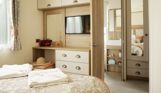 Internal of a caravan master bedroom storage, dressing area and ensuite