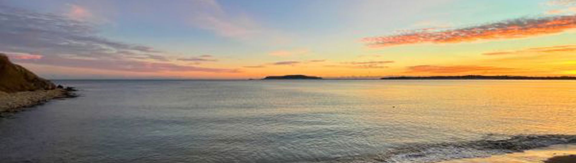 View of Bowleaze Cove at sunset