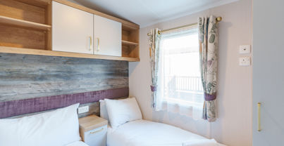 Internal of a caravan twin bedroom