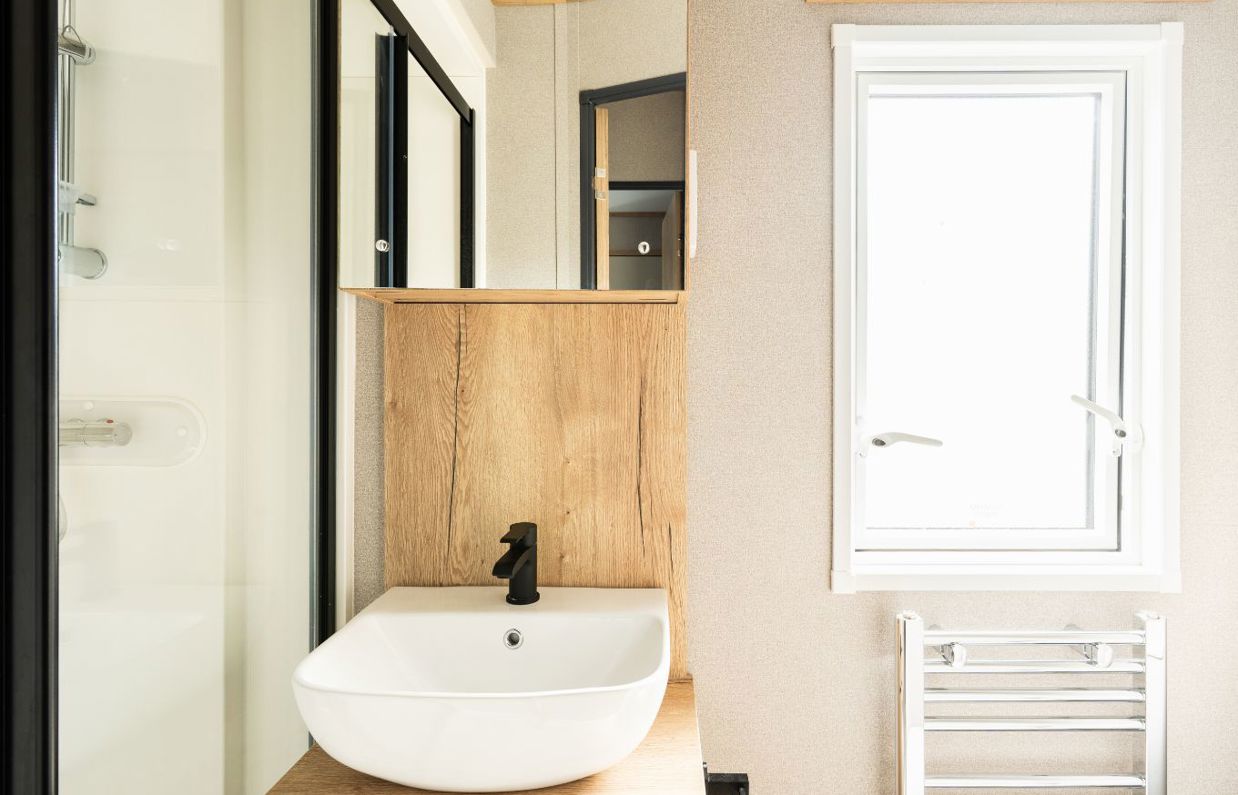 Internal of a caravan bathroom with shower and sink