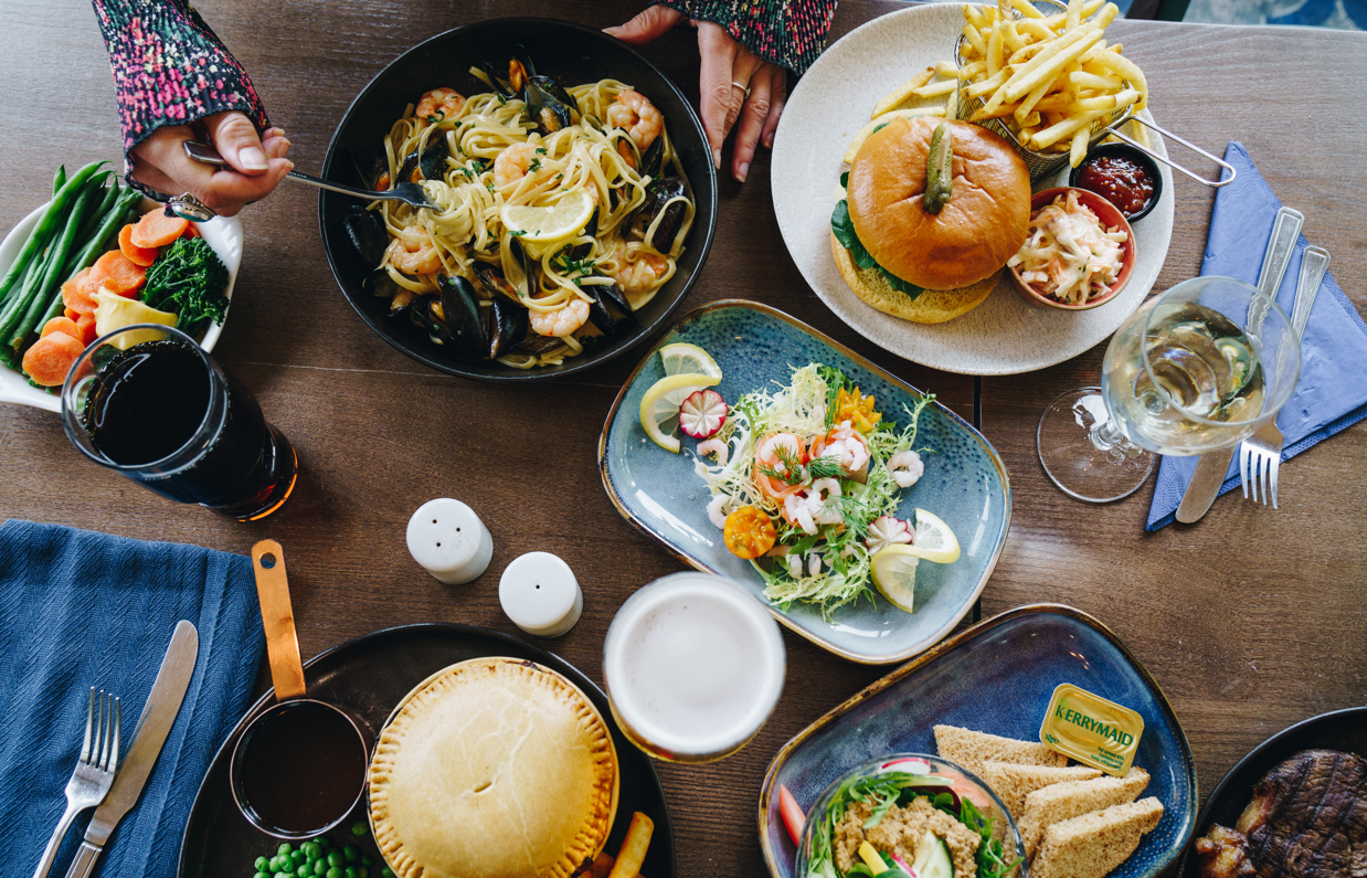 A selection of dishes from The Country Club including pie, sandwiches, burger, prawns and linguini