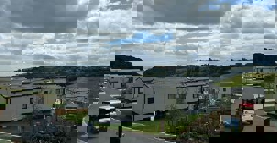 View from holiday home towards valley and sea