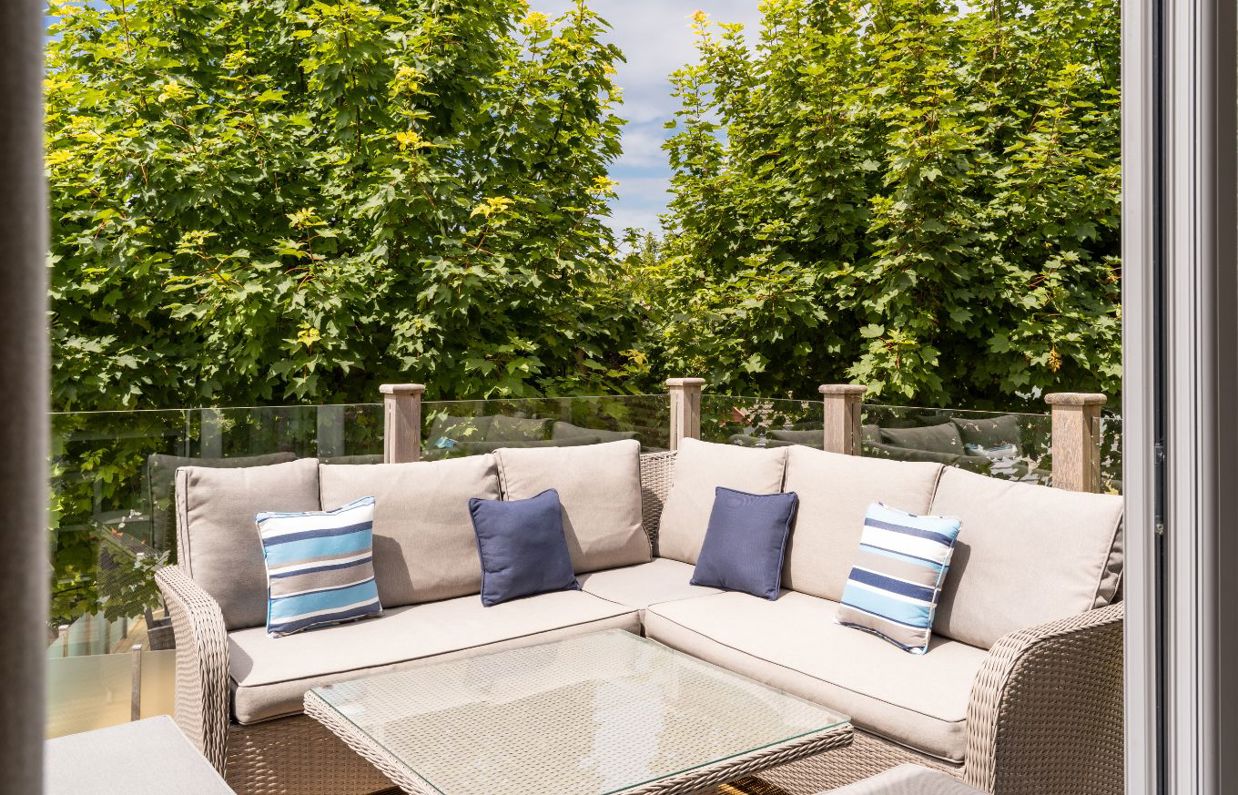 External of a lodge with decking and outdoor furniture