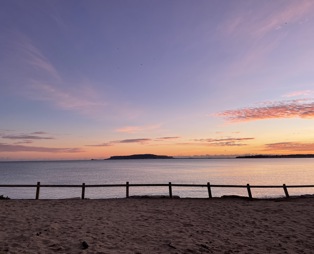 Direct beach access from southside green to bowleaze cove beach at sunset with views of Portland and the bay